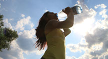 Sports Lady Drinking Bottled Water